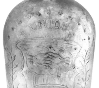 Union flask with clasped hands. (Image courtesy of Fort Riley, Conservation Branch)