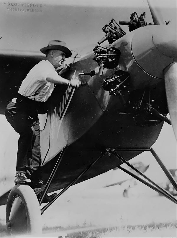 Clyde Cessna is shown cranking the Cessna Roots No. 2, Fall 1927