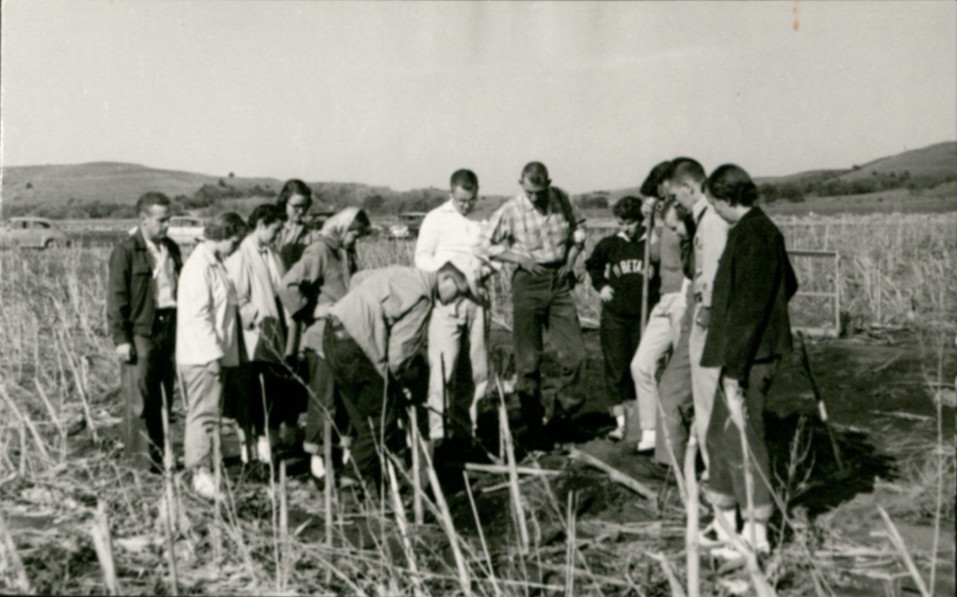KSU Archaeology Field Trip c. 1950s. Dr. Linwood Hodgdon (center) with shovel.