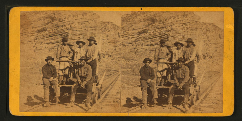 1875 photo of Chinese rail workers, entitled "John Chinaman on the Railroad"