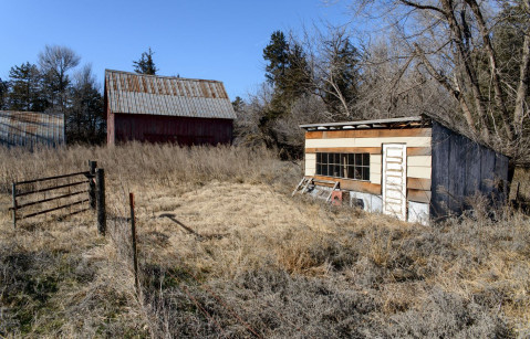 Chicken coop and barn located on Clyde Cessna's 40 acres, which he owned as an adult. Courtesy of the Chapman Center of Rural Studies.