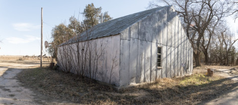 This small shed is affectionately called the Machine Shop. It was here that Clyde Cessna, his wife, and his children lived from 1912-1914 until a house was moved to the property.  Courtesy of the Chapman Center of Rural Studies.