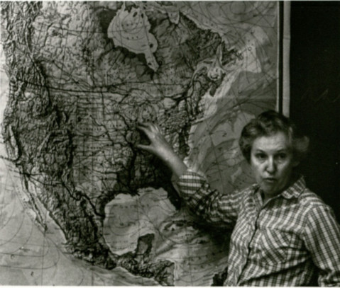Dr. Patricia J. O'Brien points at a map of central North America.