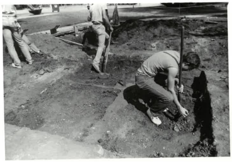 Student Clark Morrow starting excavation on the southeast quadrant of the Ft Riley privy. (Image courtesy of Fort Riley, Conservation Branch)