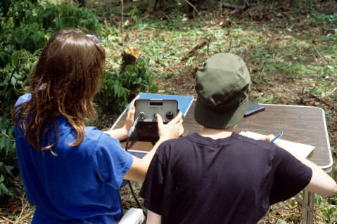 Two students recover the magnetometer readings during geophysical survey of the Quarry Creek site (summer 1991)